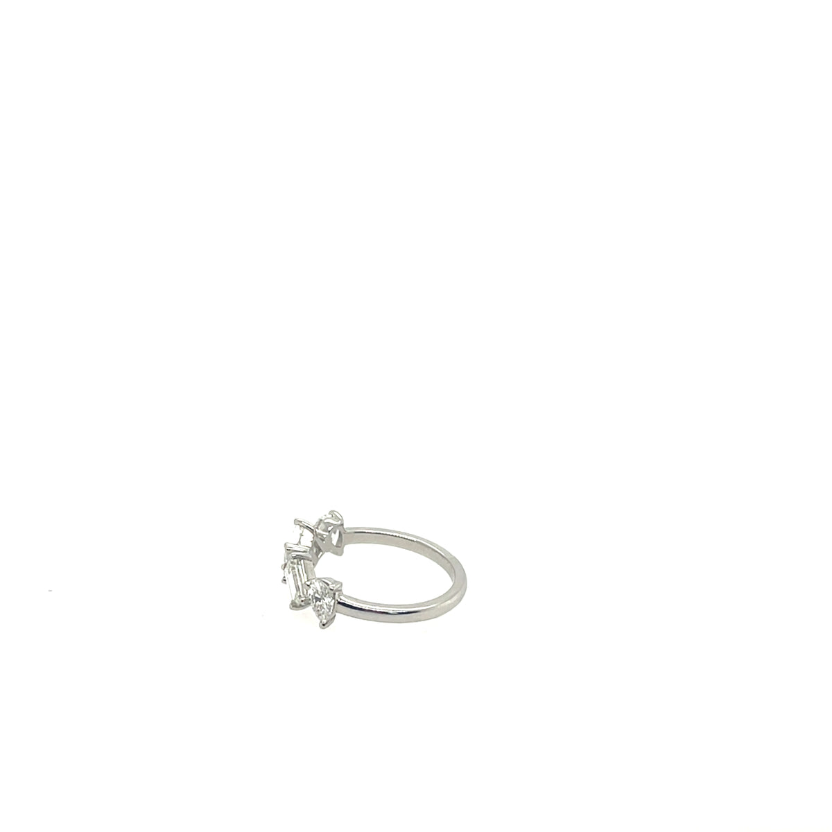 Platinum ring with Pear and Emerald Cut Diamonds