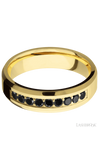 6 mm wide/Beveled/14K Yellow Gold band with an  arrangement of 9, .05 carat Round Black Diamond stones in a Bead Channel setting.
