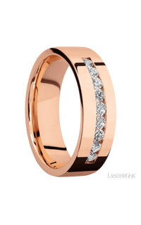 7 mm wide/Flat/14K Rose Gold band with an  arrangement of 9, .05 carat Round Diamond stones in a Channel setting.