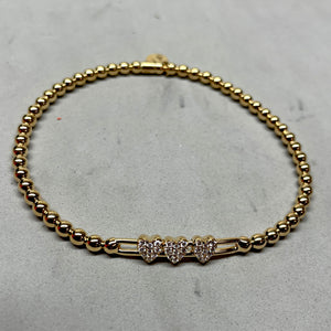 Hulchi Belluni Fidget Bracelet with Three Pave Diamond Moveable Heart Stations Yellow Gold Stretch Stackable