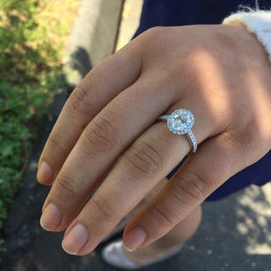 Oval Brilliant 1.30 carat Forevermark Halo Engagement Ring Platinum model finger